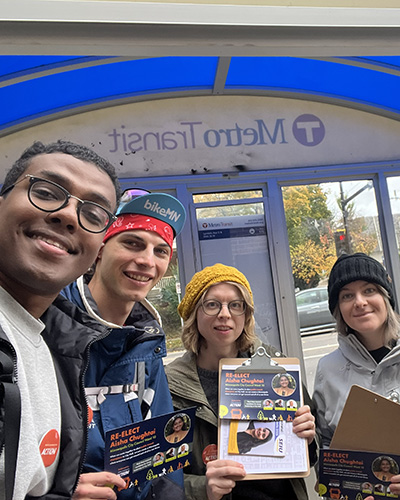 Move Minnesota Action volunteer canvass group at bus stop.